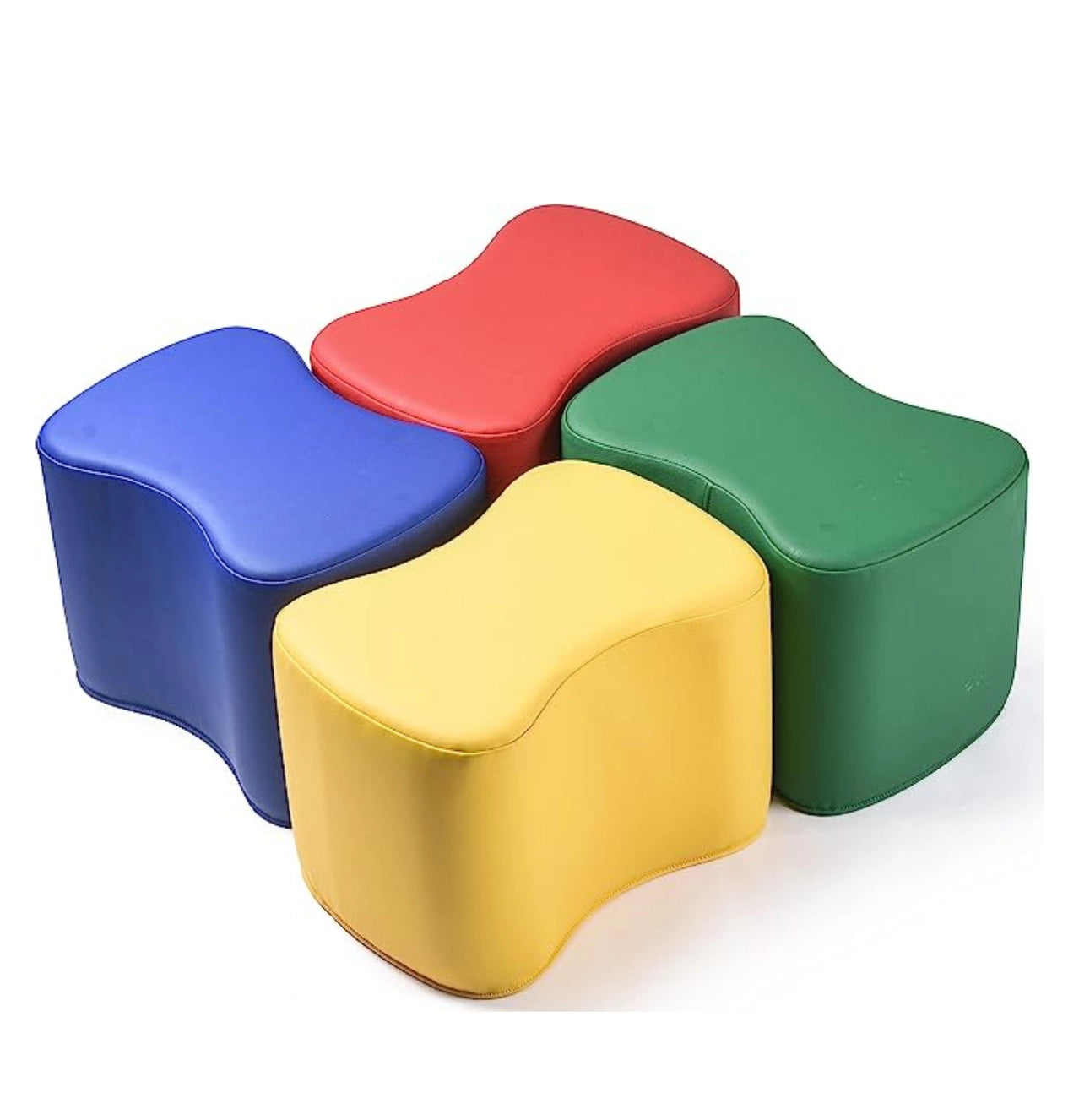 Four colorful modular foam stools for kids in blue, red, yellow, and green on a white background, perfect for classroom seating, sensory play, or modern kids furniture.