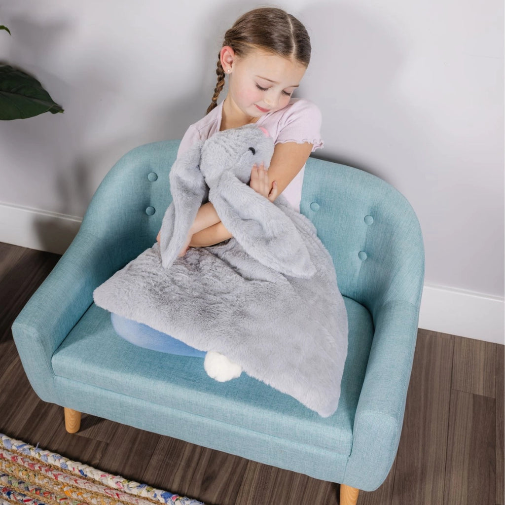 Girl hugging weighted lap bunny, autism sensory toy, calming plush for ADHD, stress relief stuffed animal, gray therapeutic bunny lap pad for kids anxiety and sensory processing support.