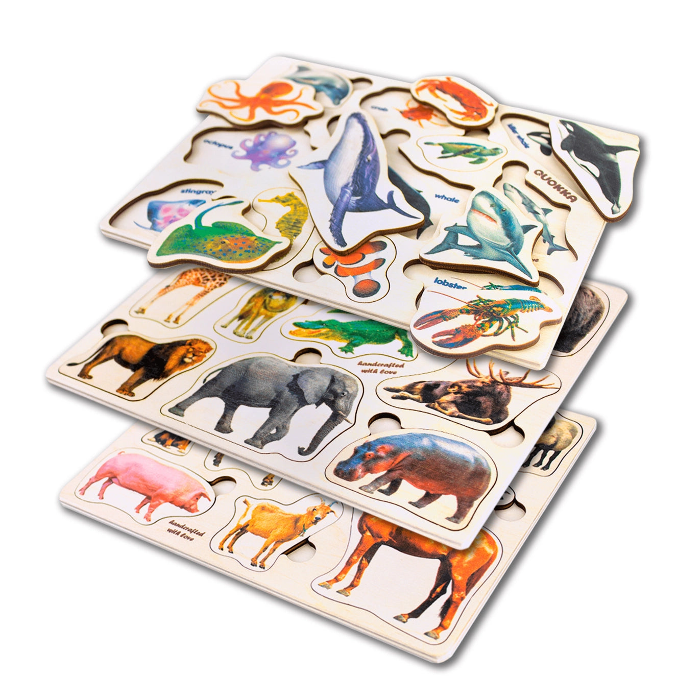 Montessori wooden animal puzzles stacked together, featuring wildlife and sea creatures like lions, elephants, whales, and octopus. Educational toy set promoting animal recognition, fine motor skills, and Montessori learning for toddlers and preschoolers.